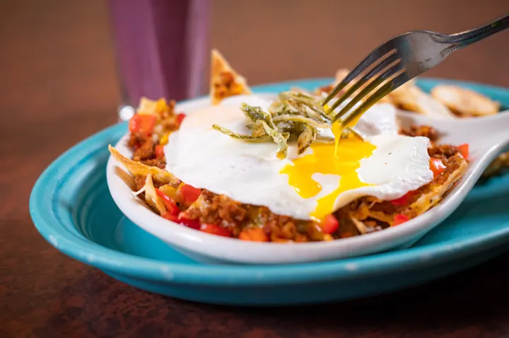 Crispy huevos with a runny basted egg