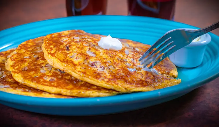 Gluten-free sweet potato pecan cakes on a turquoise plate